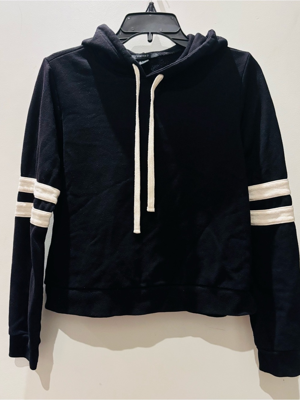 Forever 21 Cropped Black Hoodie Sweater with White Athletic Stripes on Sleeves.